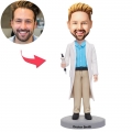 Male Doctor Holding A Syringe Custom Bobblehead With Engraved Text